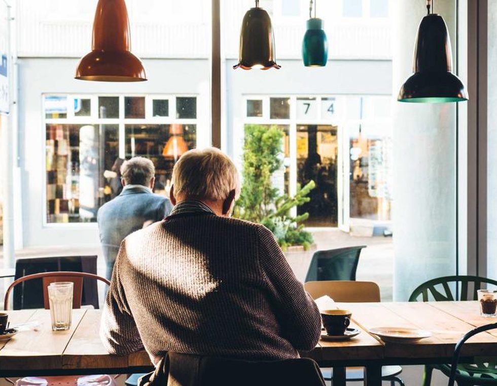 A long shared table in a bright workspace
